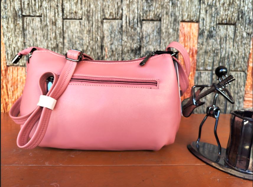 Pink with green border Novus Sling bag